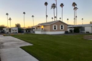 tan manufactured home green grass